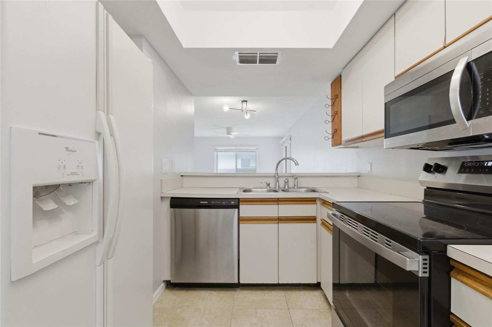 Kitchen with pantry - 2701 COUNTRYSIDE BLVD #102, CLEARWATER