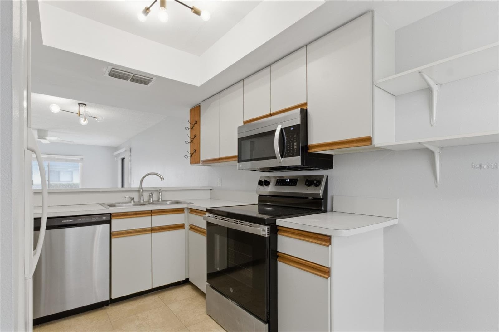 Kitchen with pantry - 2701 COUNTRYSIDE BLVD #102, CLEARWATER