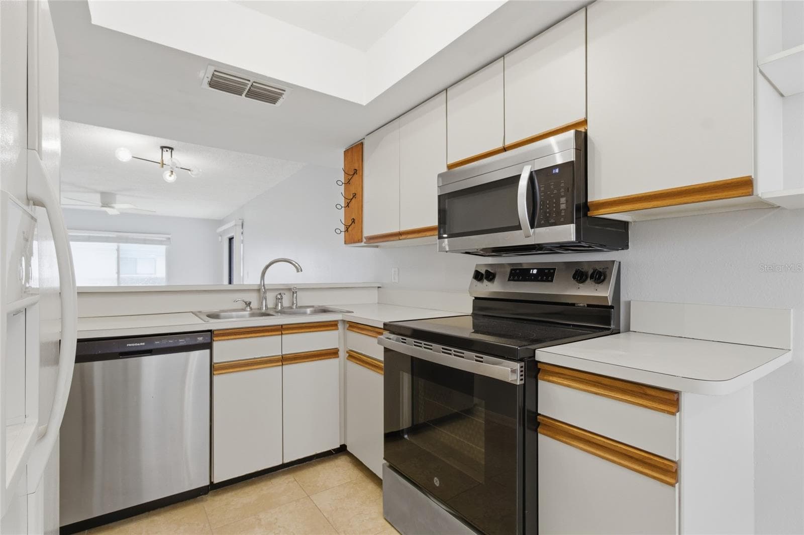 Kitchen with pantry - 2701 COUNTRYSIDE BLVD #102, CLEARWATER
