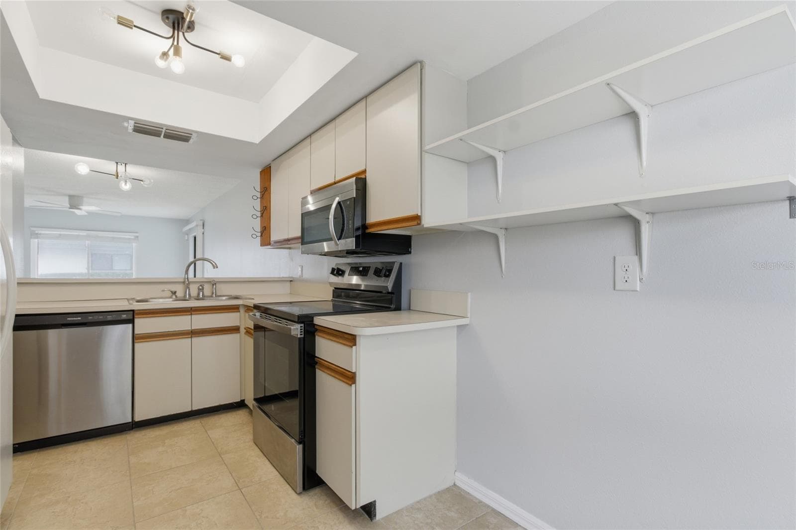 Kitchen with pantry - 2701 COUNTRYSIDE BLVD #102, CLEARWATER