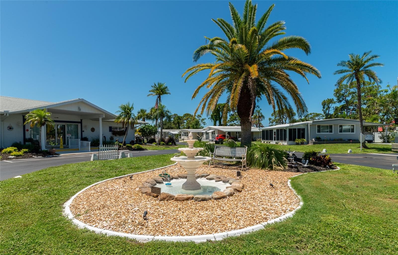 The fountain in front of the clubhouse. - 348 TROPIC DR, OSPREY
