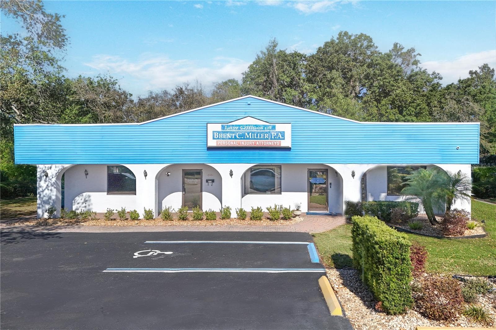 Exterior front with plenty of paved parking. - 205 E BURLEIGH BLVD, TAVARES