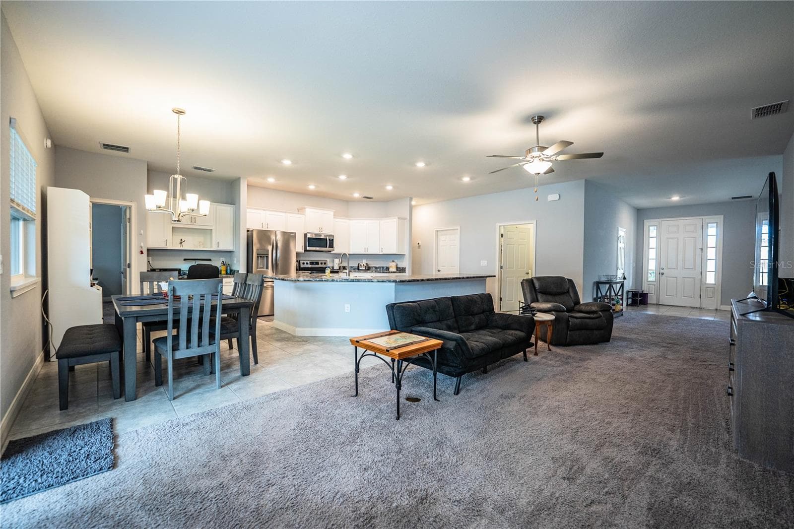 Family room looking into kitchen - 261 WALKERS POINT DR, AUBURNDALE