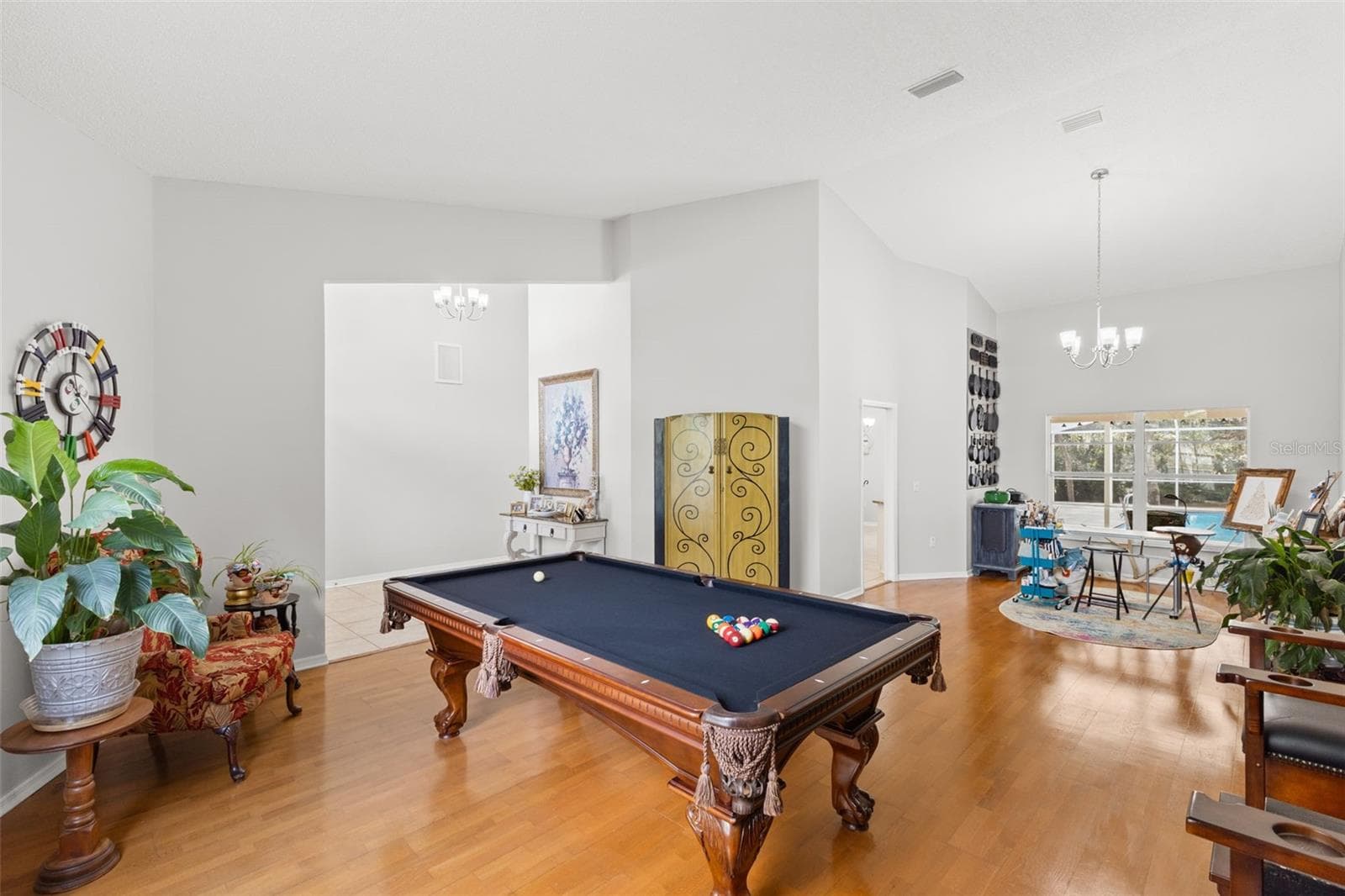 Bonus area could be used as formal living or dining. Current owners uses it as a pool room and art studio. - 3734 THORNBUSH LN, NEW PORT RICHEY