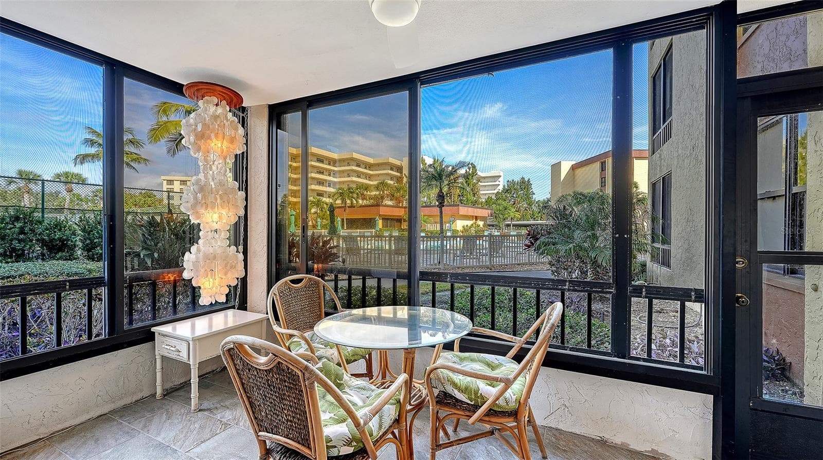 Pool view from Lanai-Screen door exit direct to pool - 8773 MIDNIGHT PASS RD #102G, SARASOTA