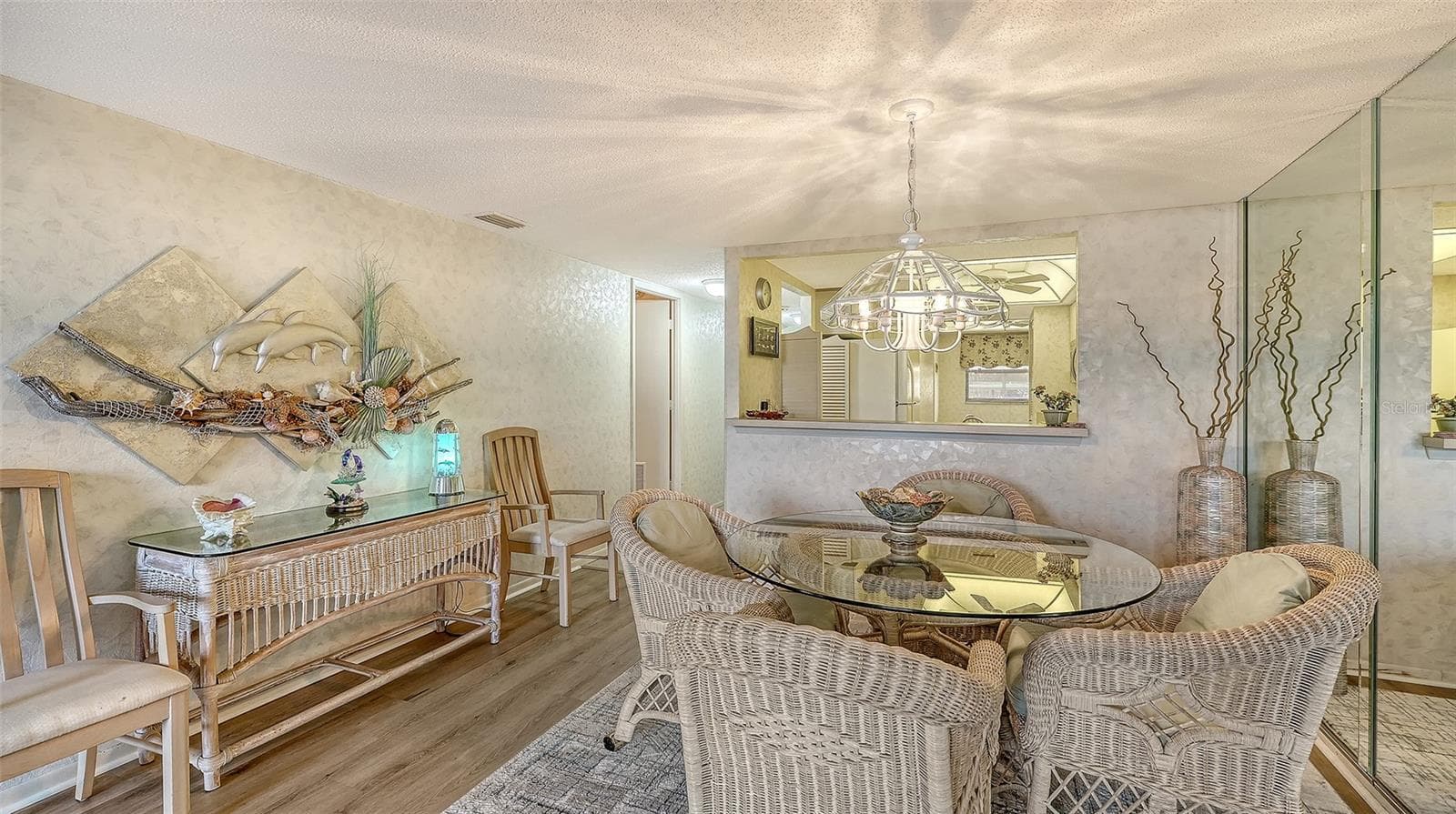 Dining area toward entry hall and bedroom on the left - 8773 MIDNIGHT PASS RD #102G, SARASOTA