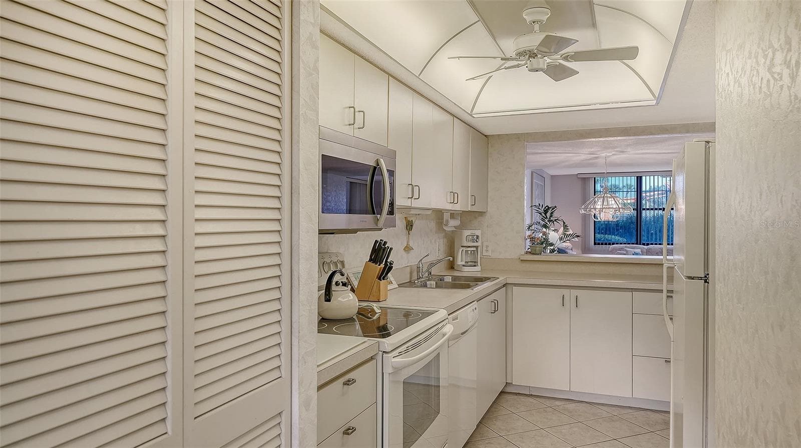 Laundry closet on the left - 8773 MIDNIGHT PASS RD #102G, SARASOTA