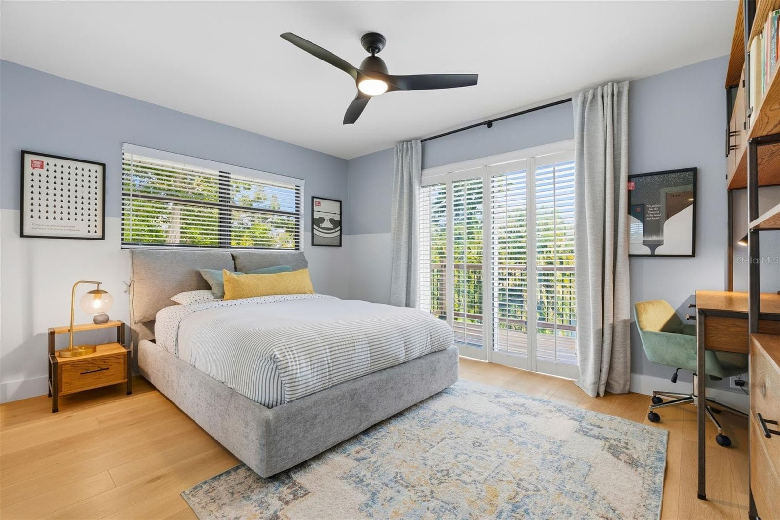 upstairs bedroom with doors leading to balcony - 6349 RAVENWOOD WAY, SARASOTA