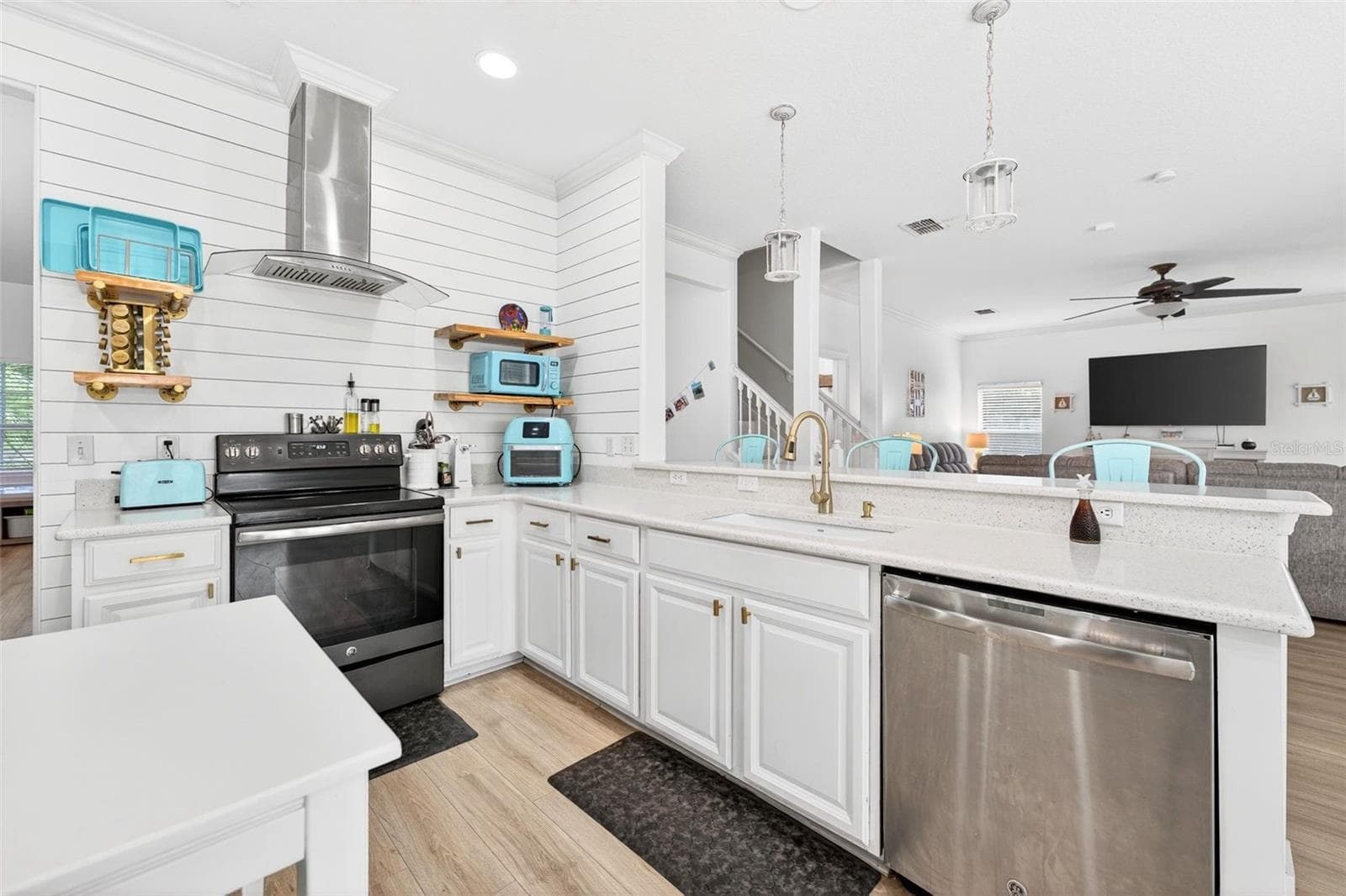 Luxury vinyl flooring is easy to clean and eases the strain of standing on cold hard tile - 20930 SULLIVAN RANCH BLVD, MOUNT DORA