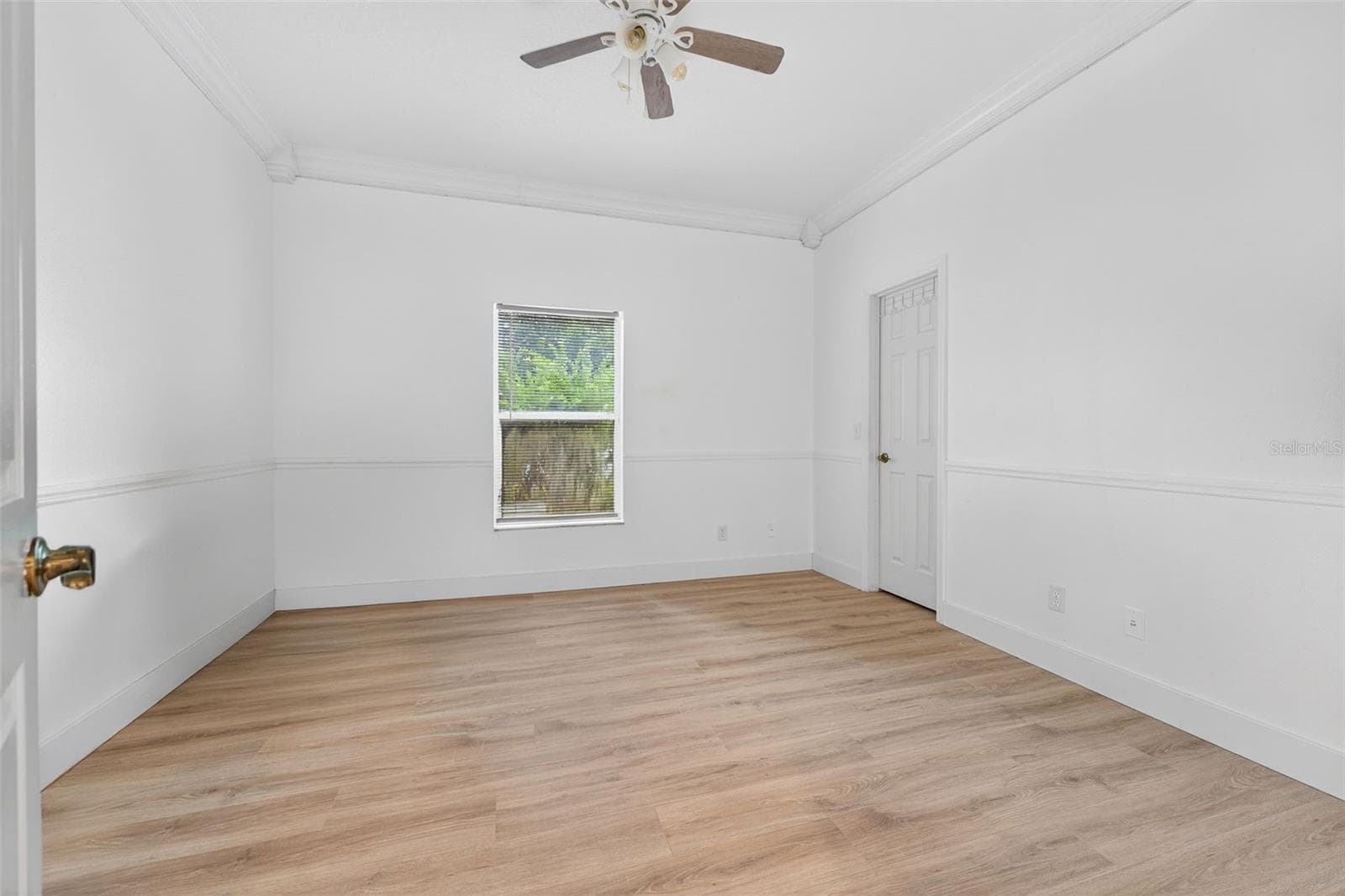 Downstairs bedroom with door into the walk-in closet found in all 5 secondary bedrooms - 20930 SULLIVAN RANCH BLVD, MOUNT DORA