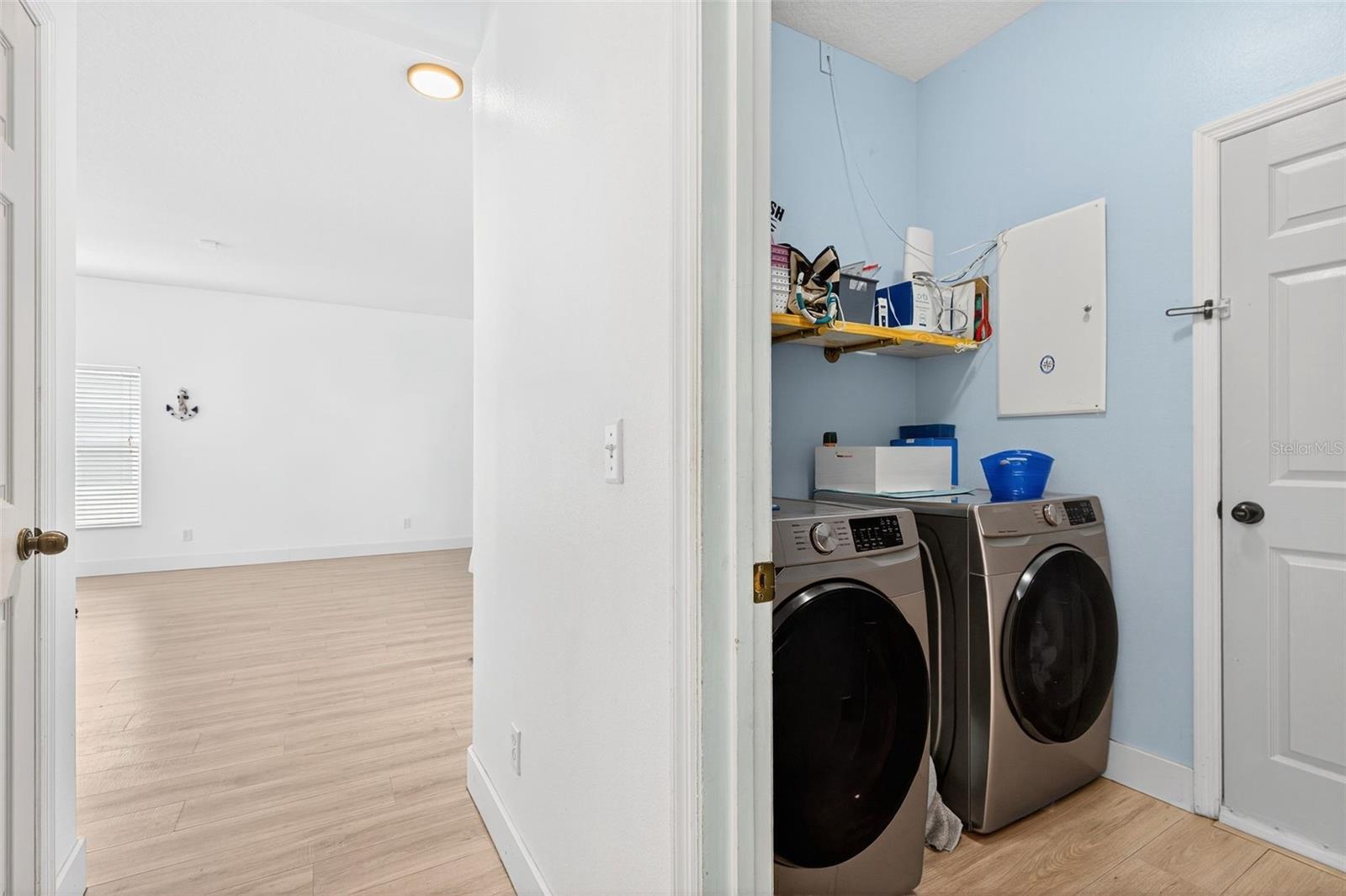 Indoor laundry with OnQ panel - 20930 SULLIVAN RANCH BLVD, MOUNT DORA
