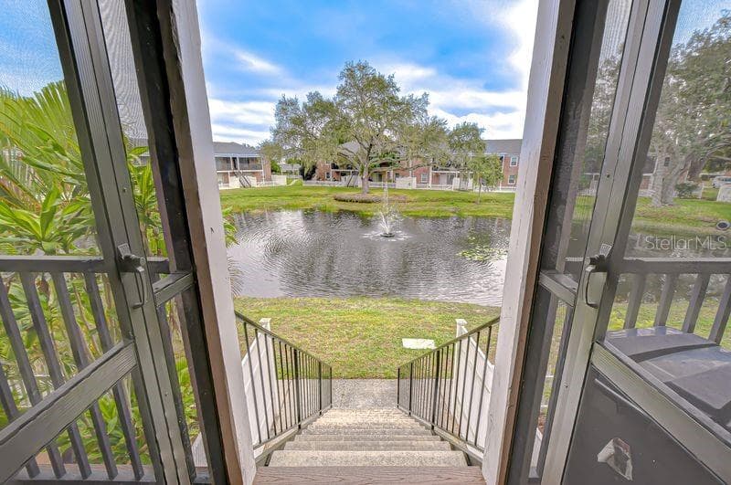 Stroll down to the pond with water fountain - 13693 ORANGE SUNSET DR #203, TAMPA