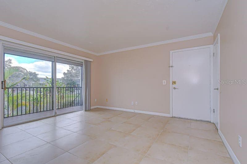 Light and bright open floor plan with neutral paint and ceramic tile flooring throughout - 13693 ORANGE SUNSET DR #203, TAMPA