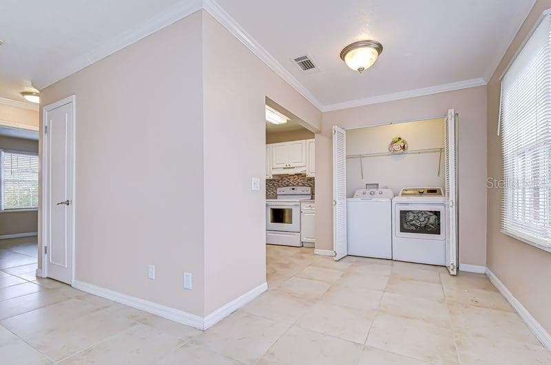 Convenient Laundry Closet with Washer and Dryer - 13693 ORANGE SUNSET DR #203, TAMPA