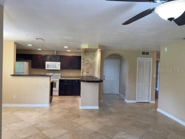 VIEW FROM LIVING ROOM INTO KITCHEN - 200 AFTON SQ #11-102, ALTAMONTE SPRINGS