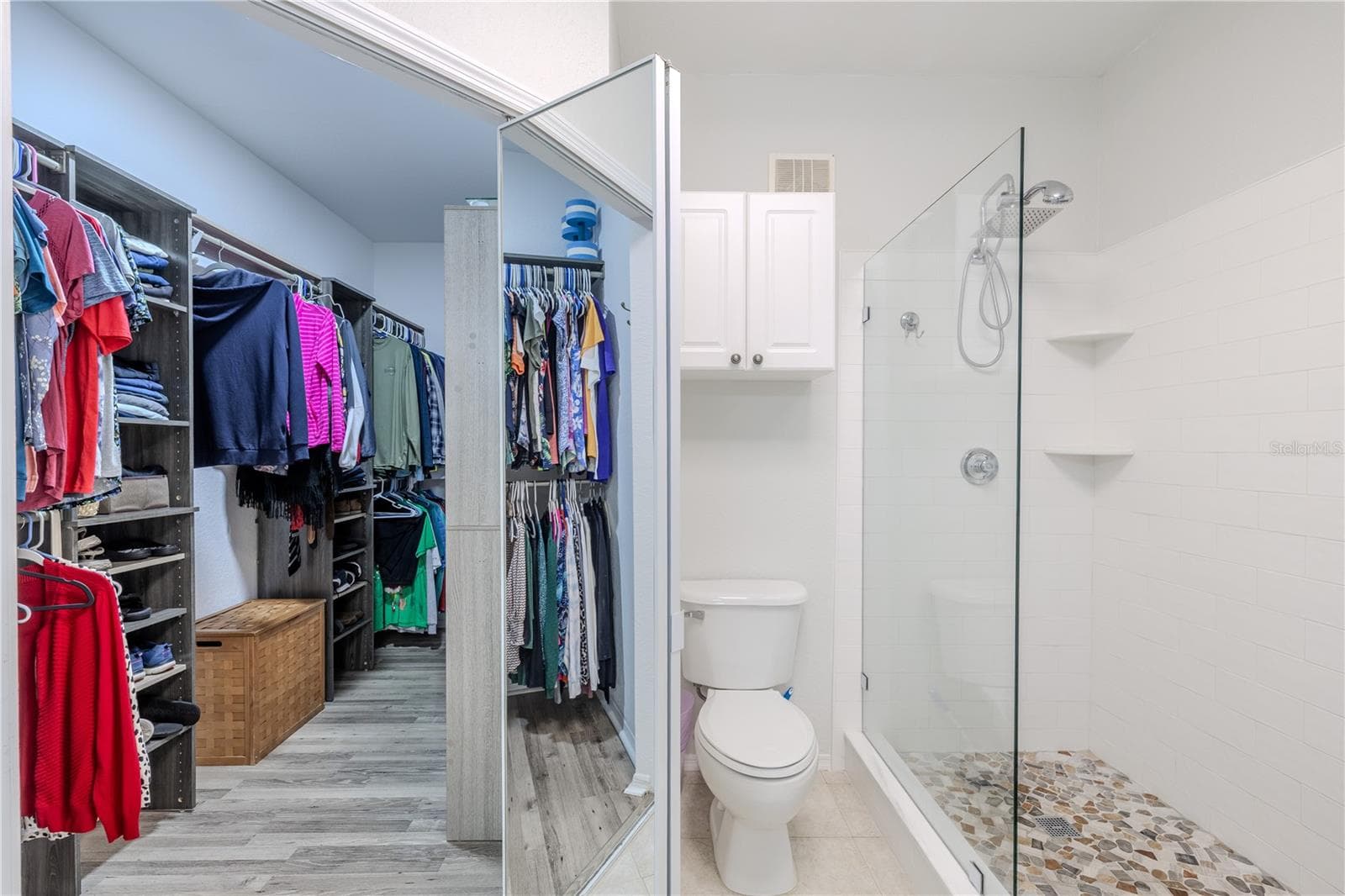 Primary bedroom spacious walk in closet located in the en-suite bathroom. - 2738 VIA TIVOLI #220B, CLEARWATER