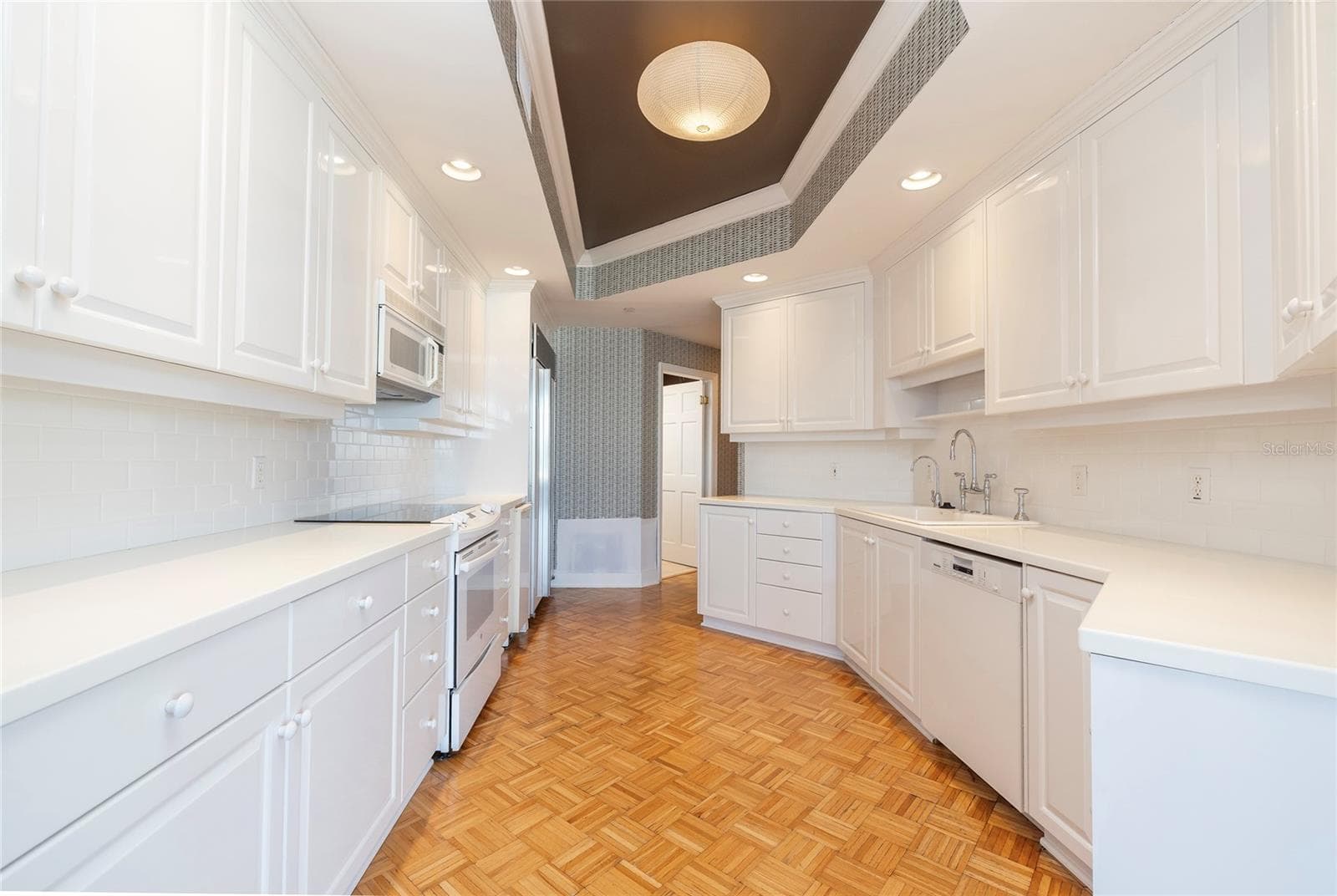 Kitchen -- Laundry room through the open door - 2 SEASIDE LN #103, BELLEAIR