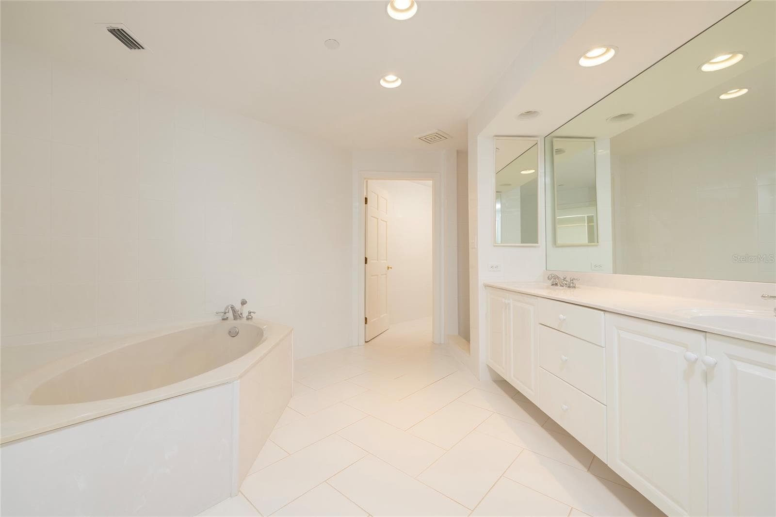 Master Bathroom with soaking tub, separate shower, dual vanities and separate water closet - 2 SEASIDE LN #103, BELLEAIR