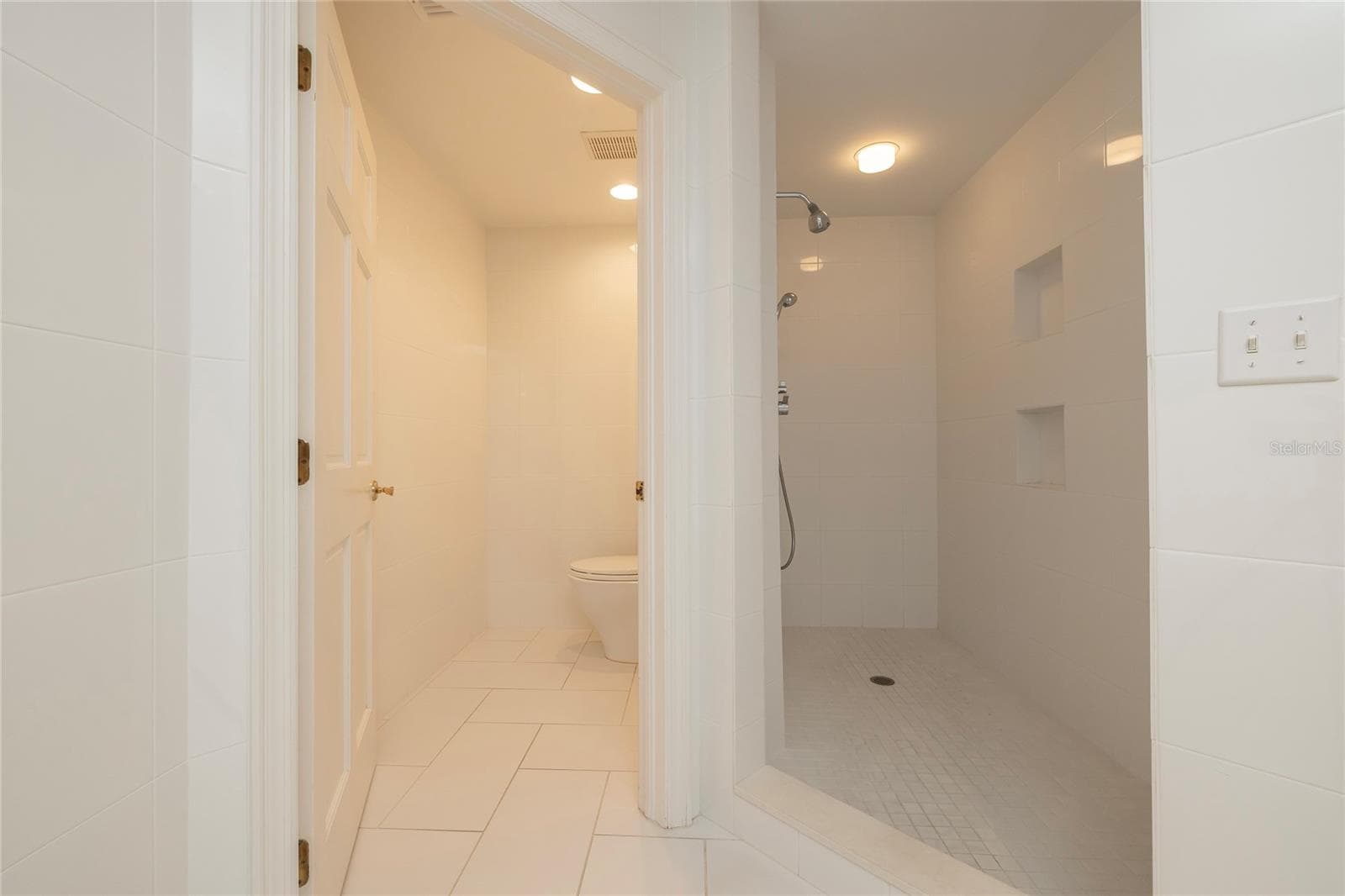 Master Bathroom with soaking tub, separate shower, dual vanities and separate water closet - 2 SEASIDE LN #103, BELLEAIR