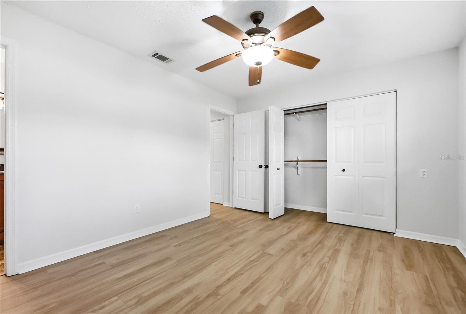 Primary bedroom showing large closet - 249 N HILL AVE #30, DELAND