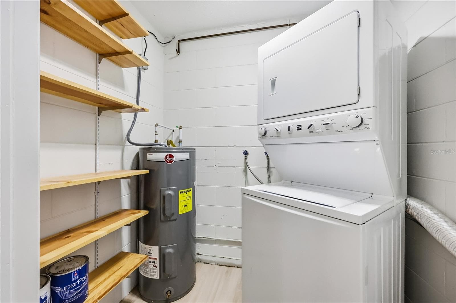 Laundry room with stack washer and dryer - 249 N HILL AVE #30, DELAND