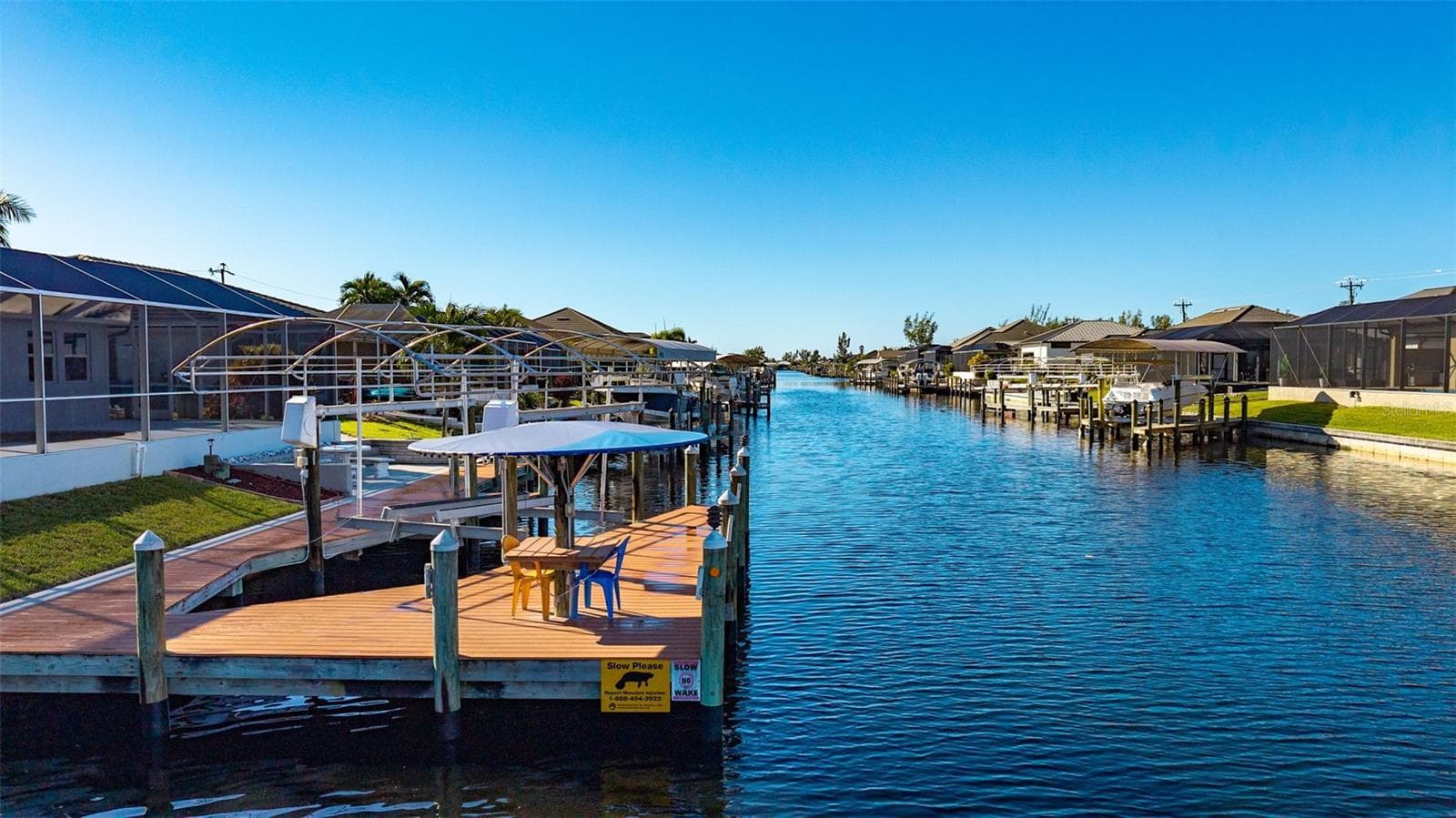 Deck with lift, tiki hut, electric, and water - 430 NW 39TH AVE, CAPE CORAL