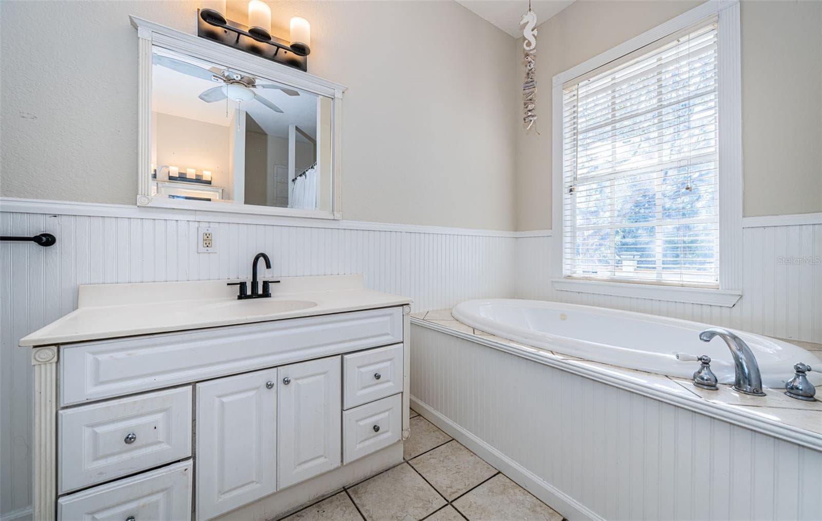 En Suite From Primary Bedroom. 5127 Bay Blvd Port Richey Waterfront Home - 5127 BAY BLVD, PORT RICHEY