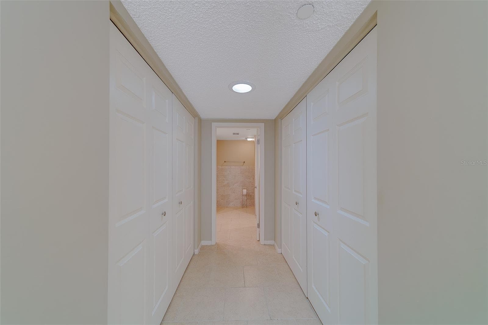 Going into master bathroom hers and his closets - 1480 GULF BLVD #201, CLEARWATER BEACH