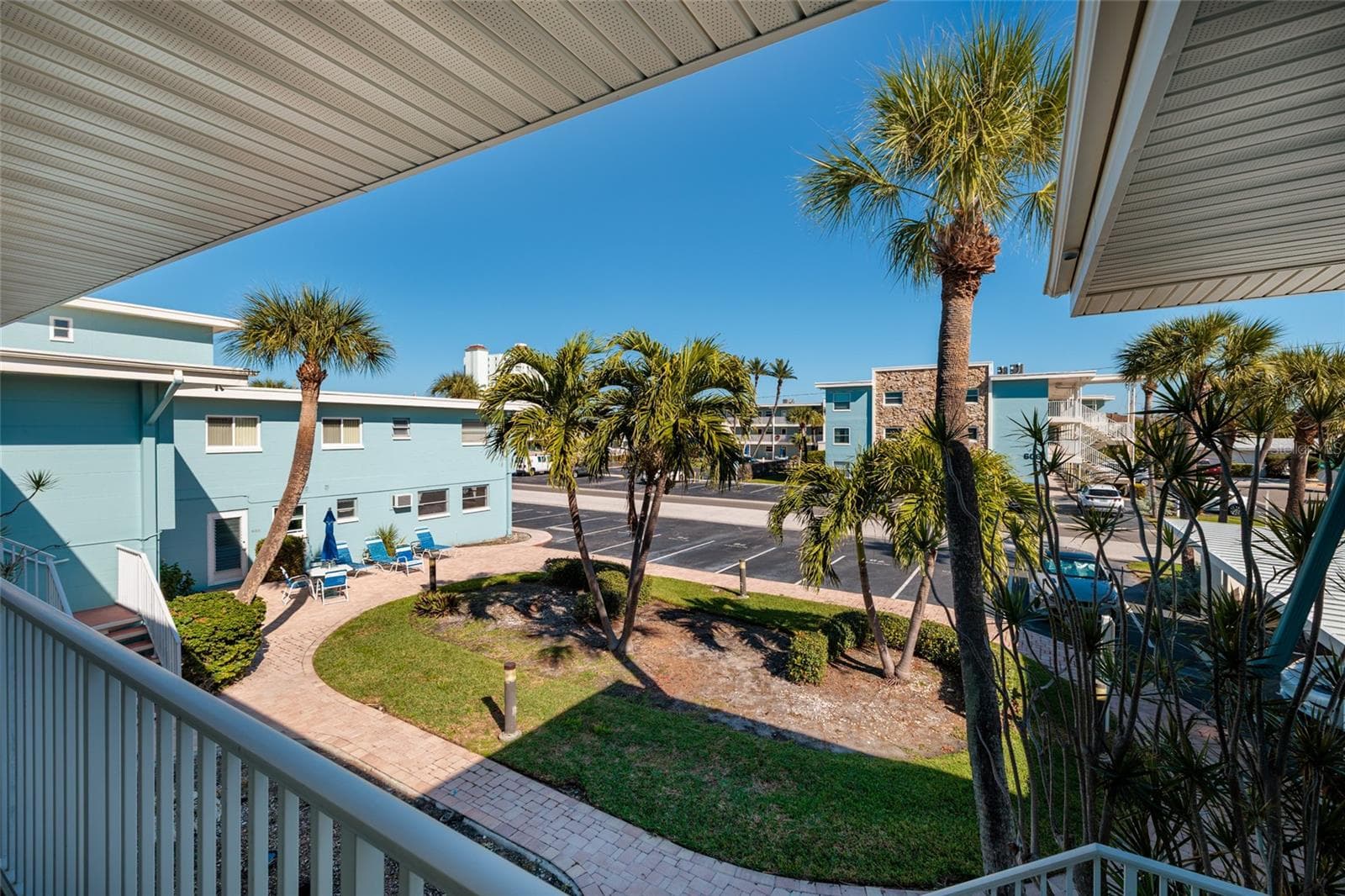 View from walkway/ porch outside of front door. Laundry/storage room is downstairs & straight down the walkway. - 6000 2ND ST E #6, ST PETE BEACH