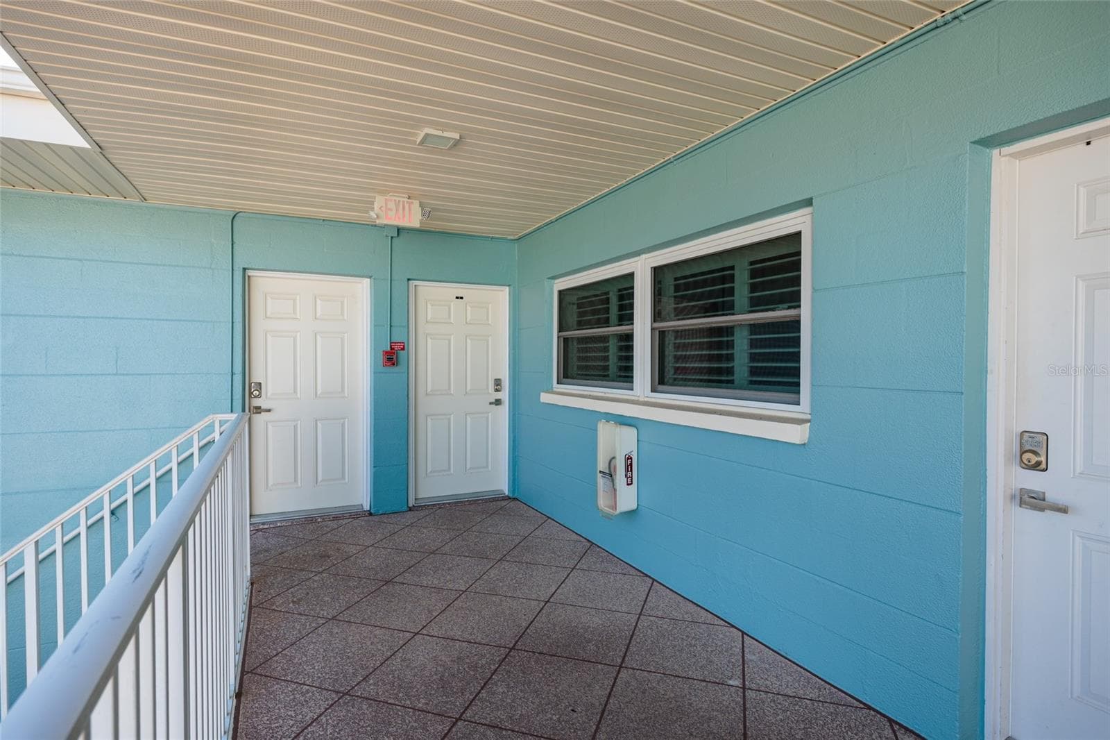 Unit has 2 doors. Left is primary bedroom, right is main door. - 6000 2ND ST E #6, ST PETE BEACH