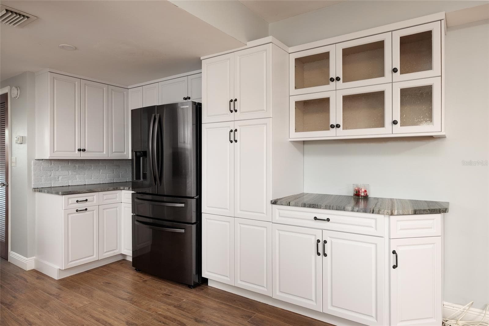 Kitchen w/extra cabinets & pantry w/Pull out shelves. - 6000 2ND ST E #6, ST PETE BEACH
