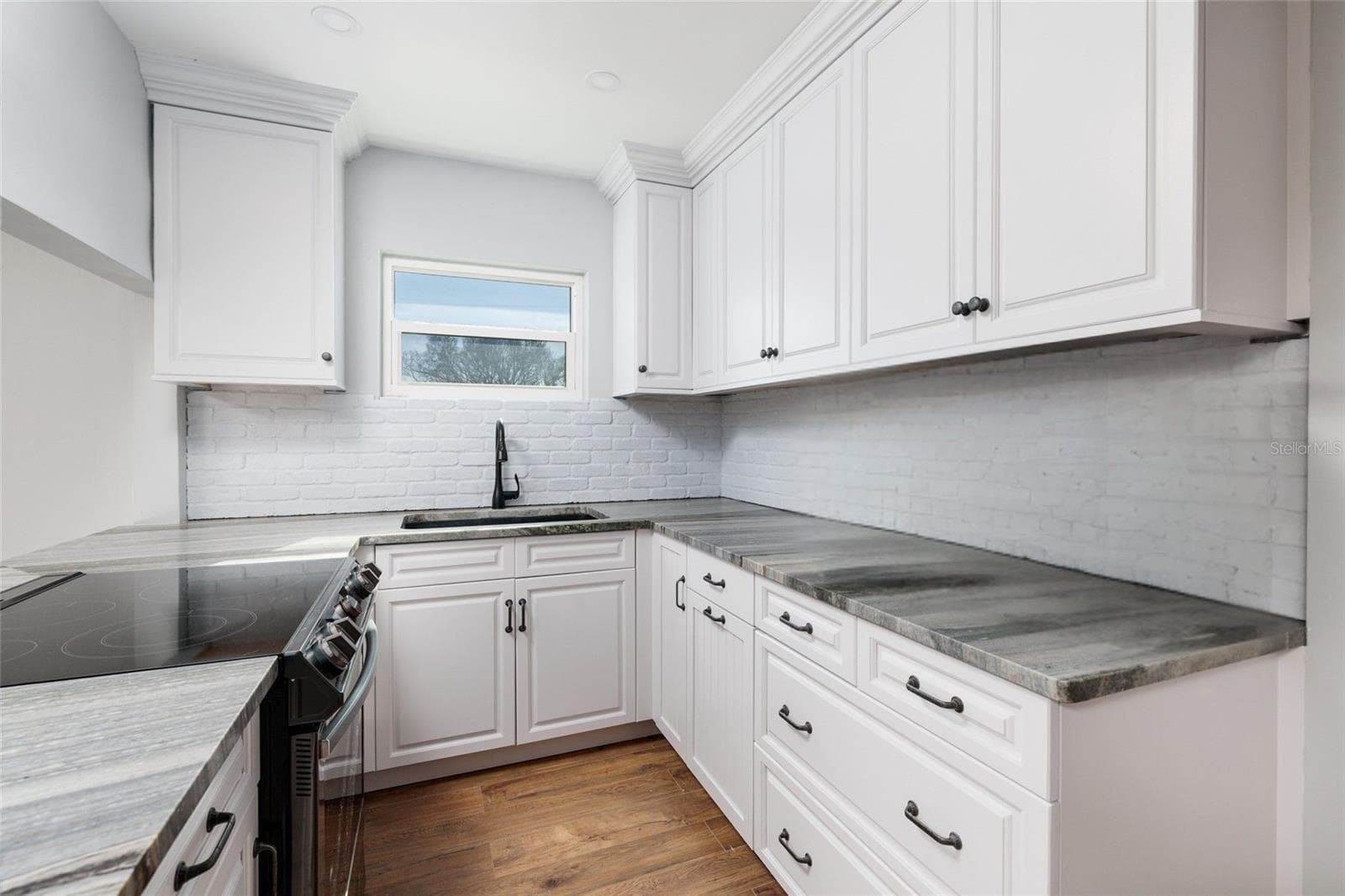 Kitchen renovated 2023 w/new appliances cabinets & granite counters. - 6000 2ND ST E #6, ST PETE BEACH
