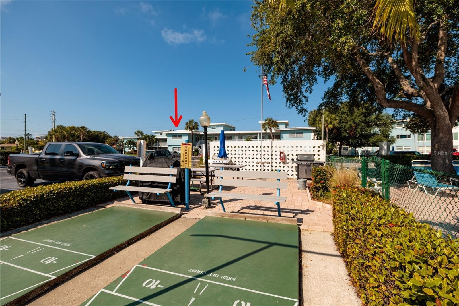 Grilling area 1 w/shuffleboard courts & pool across street from the unit. - 6000 2ND ST E #6, ST PETE BEACH
