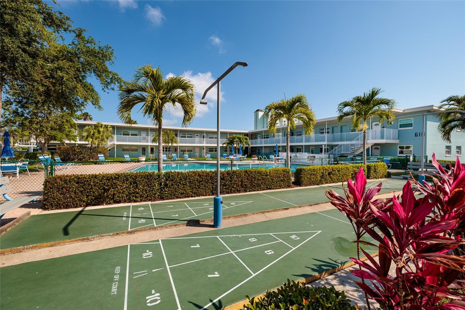 Shuffleboard courts in grilling area across from unit. - 6000 2ND ST E #6, ST PETE BEACH