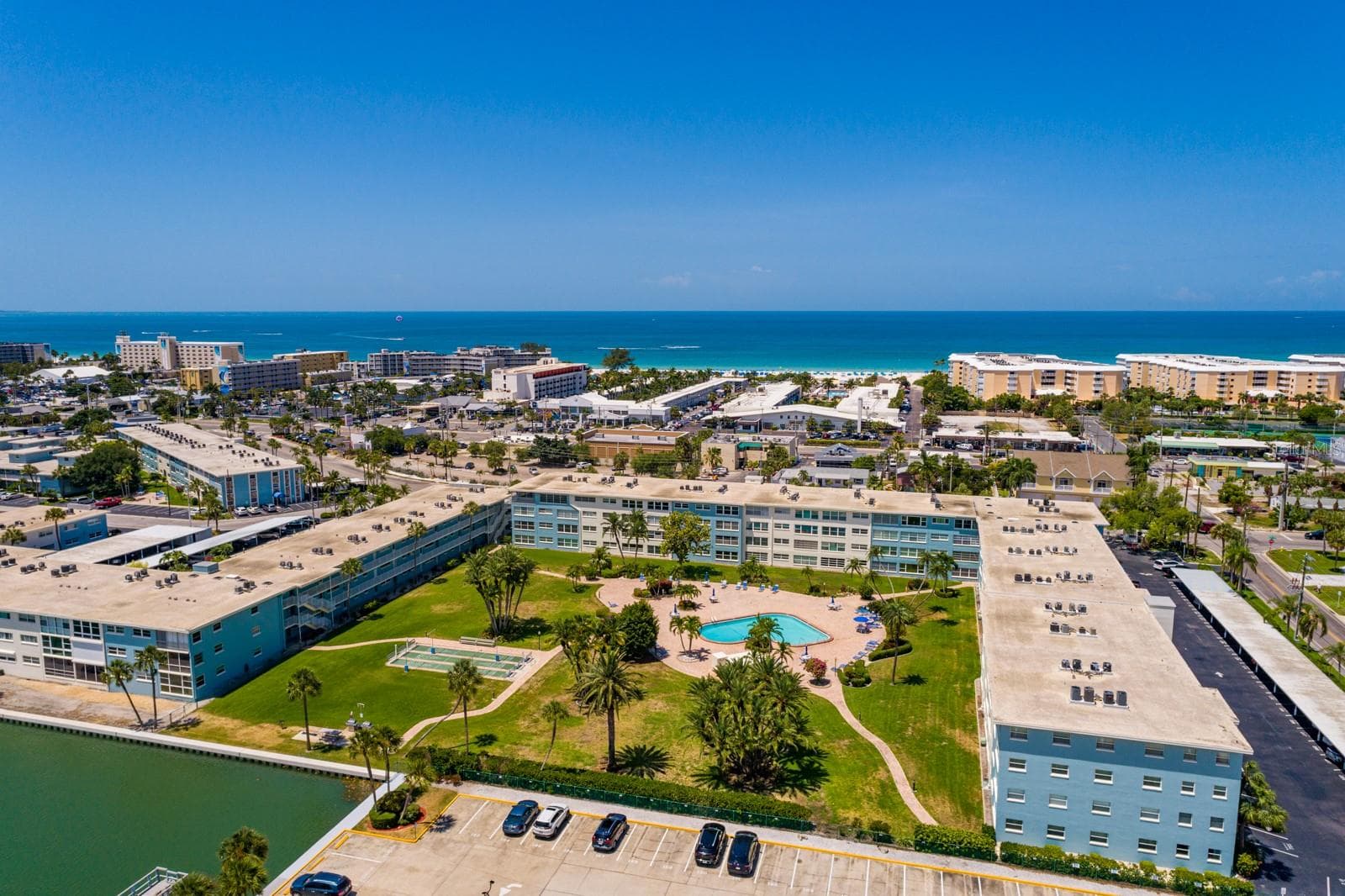 North pool (heated), courtyard & grilling area. - 6000 2ND ST E #6, ST PETE BEACH