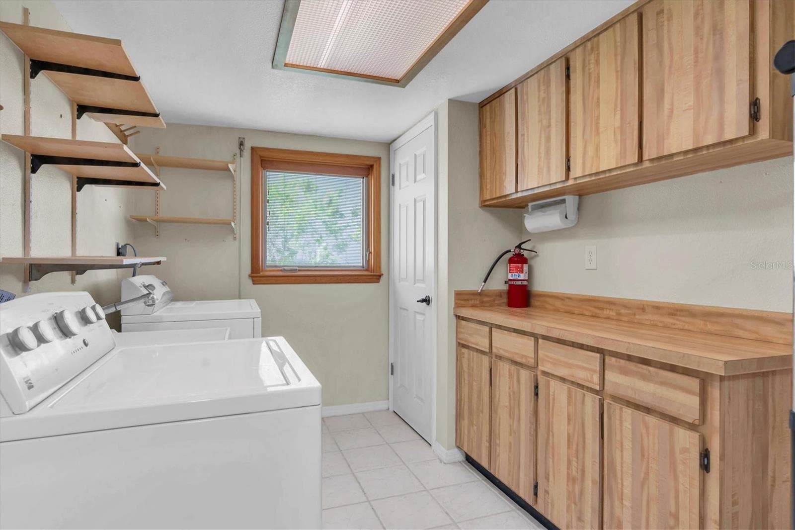 Laundry room with AC within the garage space - 4935 62ND AVE S, ST PETERSBURG