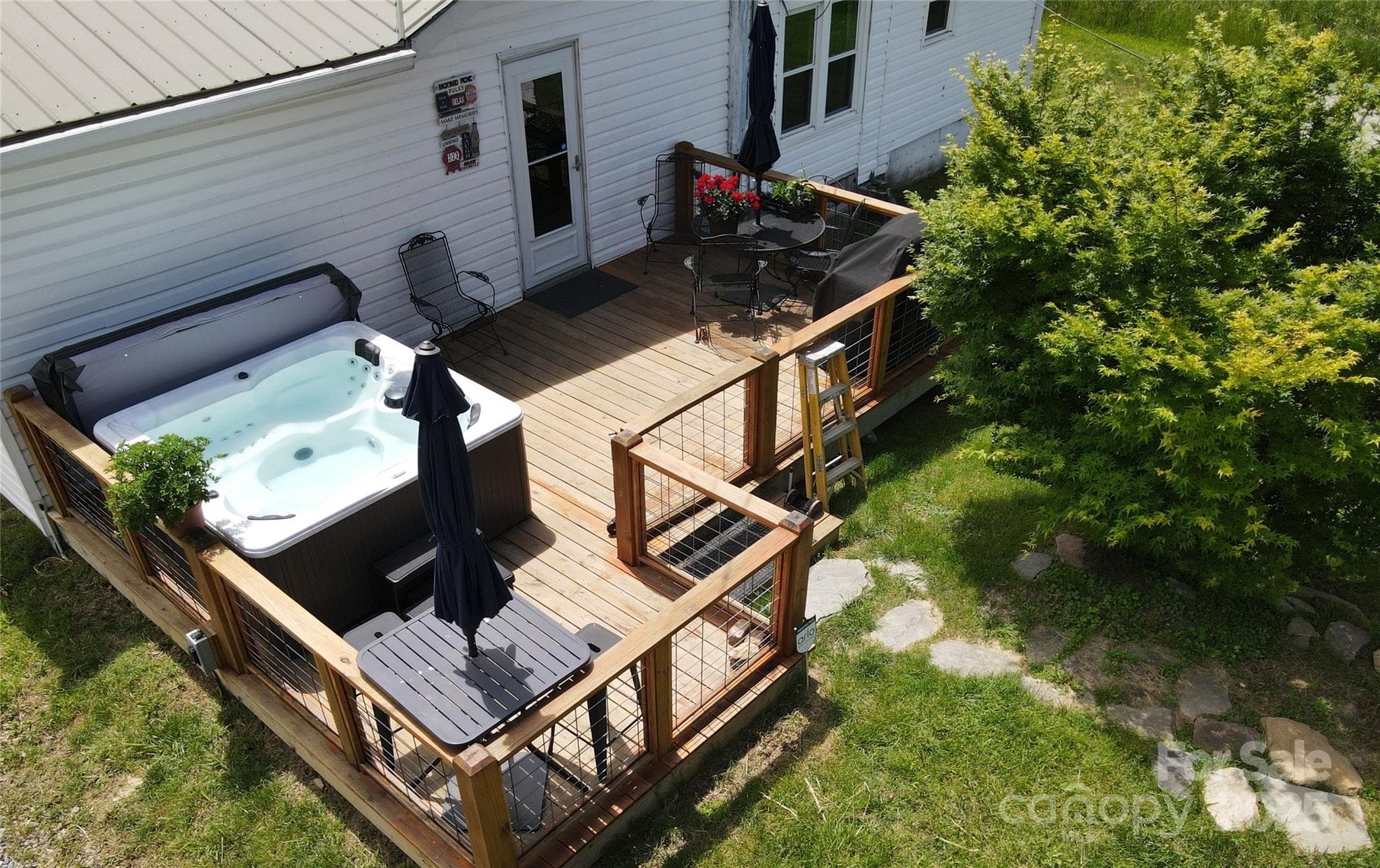 Rear Deck with the grill and table on its right side. - 626 Fairview Loop, Hot Springs