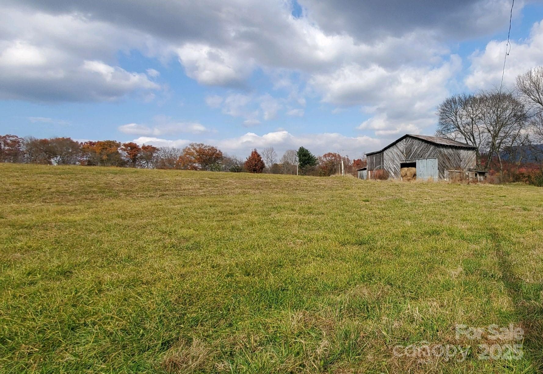 Beautiful mountain meadow with its barn in the background.... adjacent to the property in the back side. - 626 Fairview Loop, Hot Springs