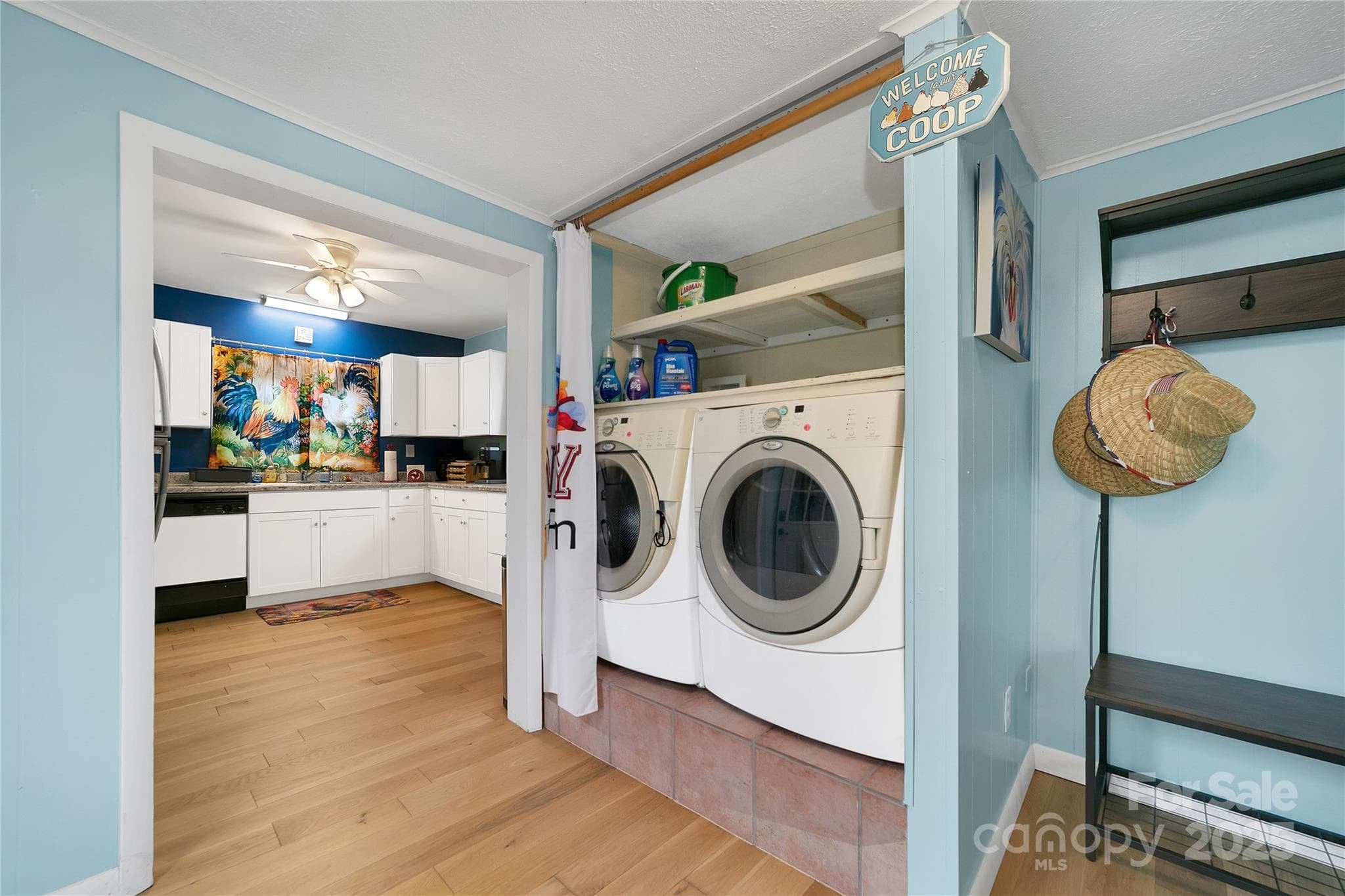 Laundry area is complete with easy access washer and dryer and plenty of shelving for extras. - 626 Fairview Loop, Hot Springs