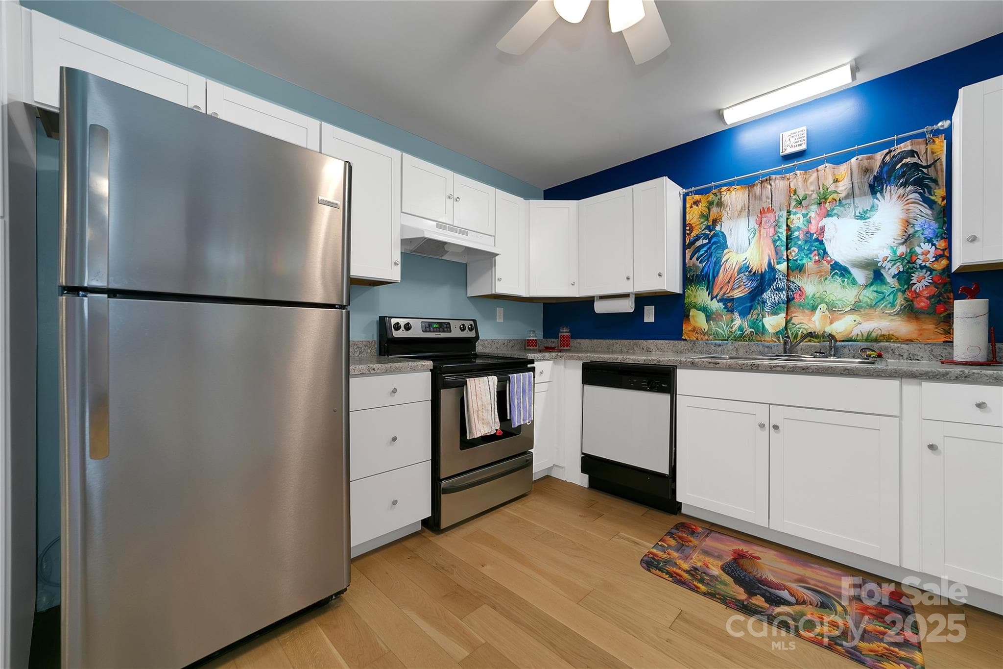 The kitchen is well appointed with appliances, and adorned with its own group of hens! - 626 Fairview Loop, Hot Springs