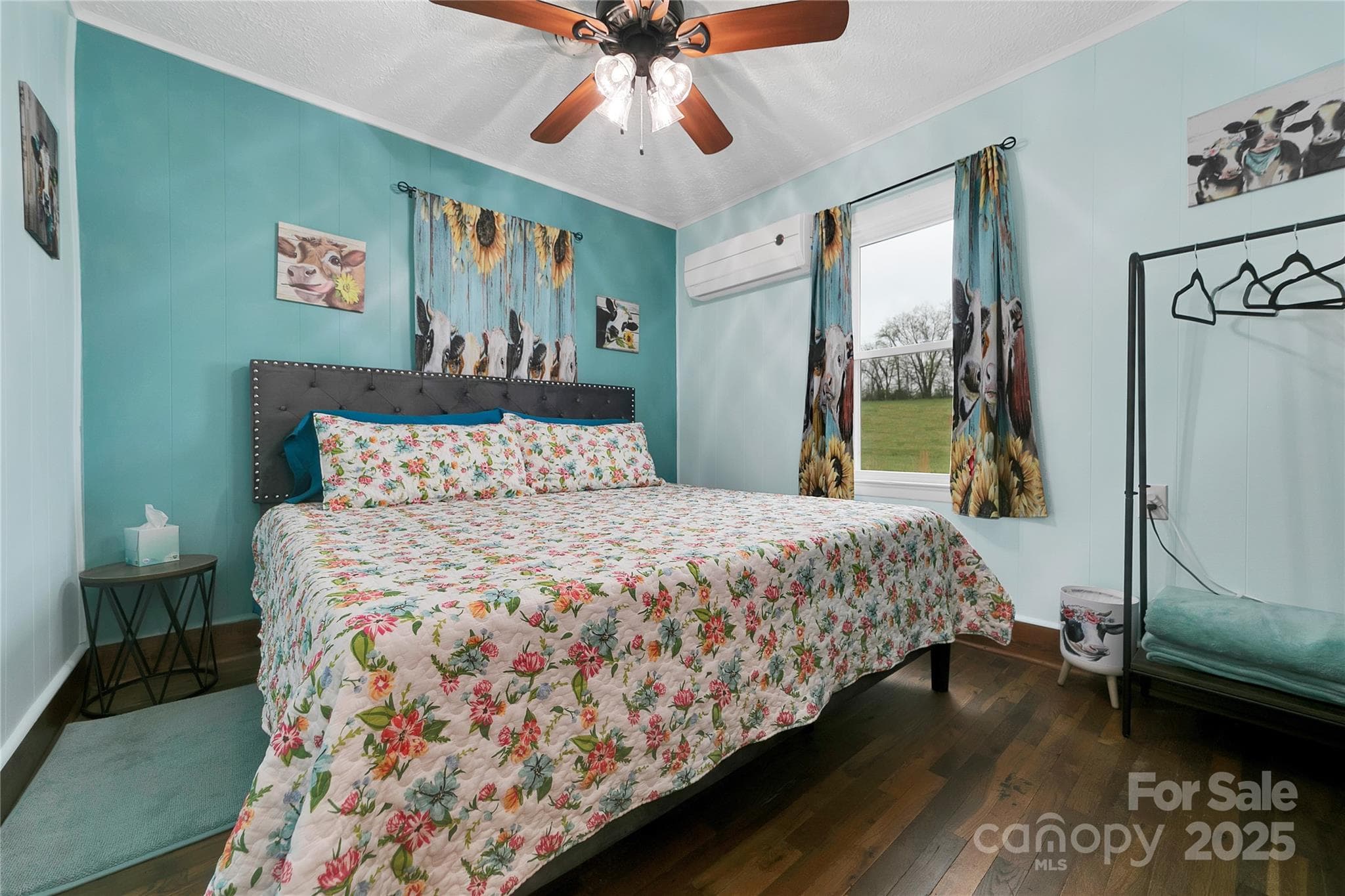 The front bedroom suite boasts its king bed with plenty of space to move around. The entire suite is adorned with adorable heifers at every turn! - 626 Fairview Loop, Hot Springs