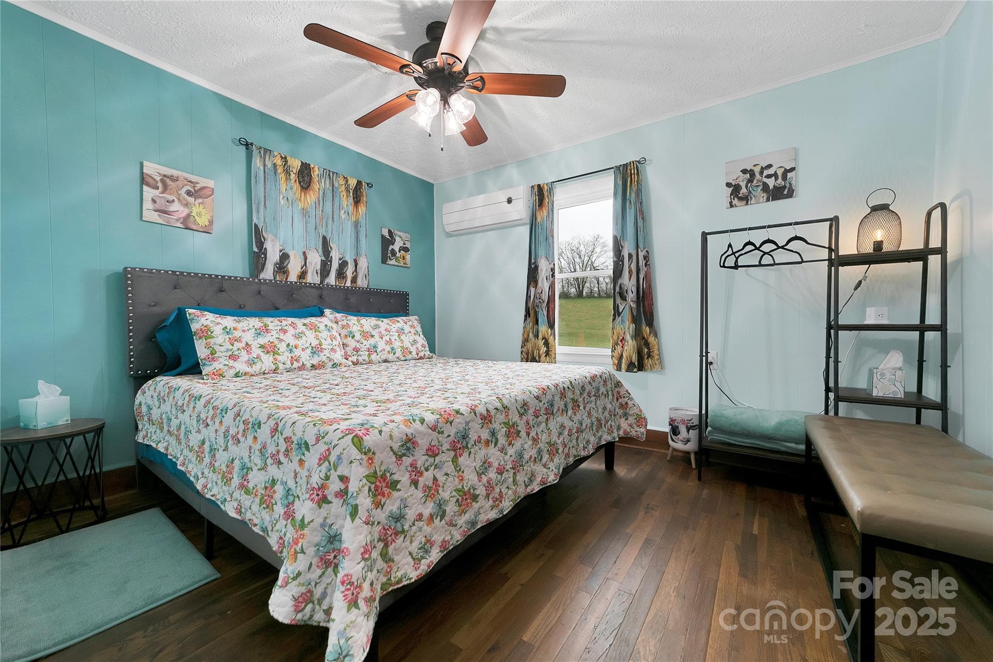 The front bedroom suite boasts its king bed with plenty of space to move around. The entire suite is adorned with adorable heifers at every turn! - 626 Fairview Loop, Hot Springs