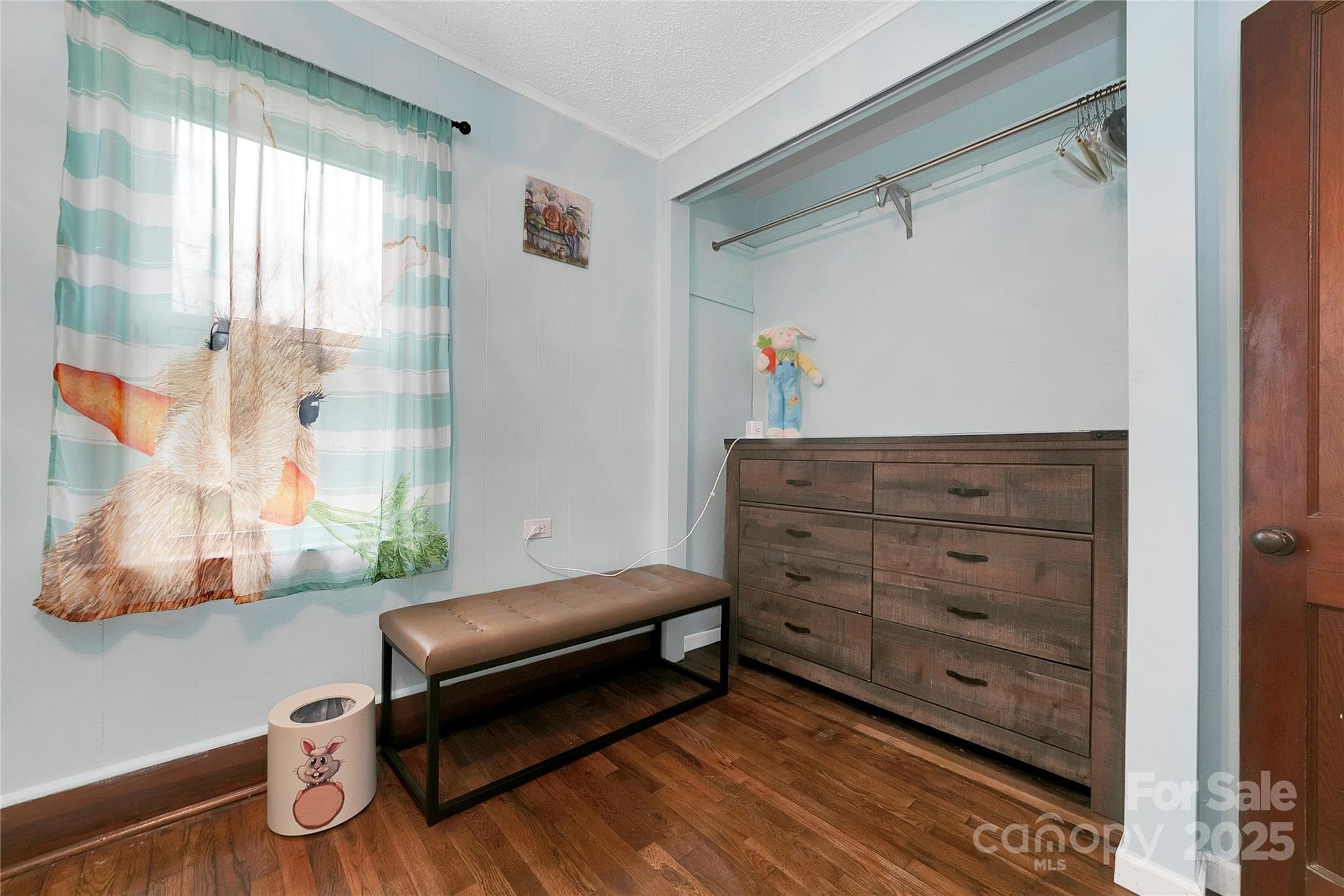 The middle bedroom is alive with bunny rabbits in every corner! Light and bright with beautiful oak hardwood floors. - 626 Fairview Loop, Hot Springs