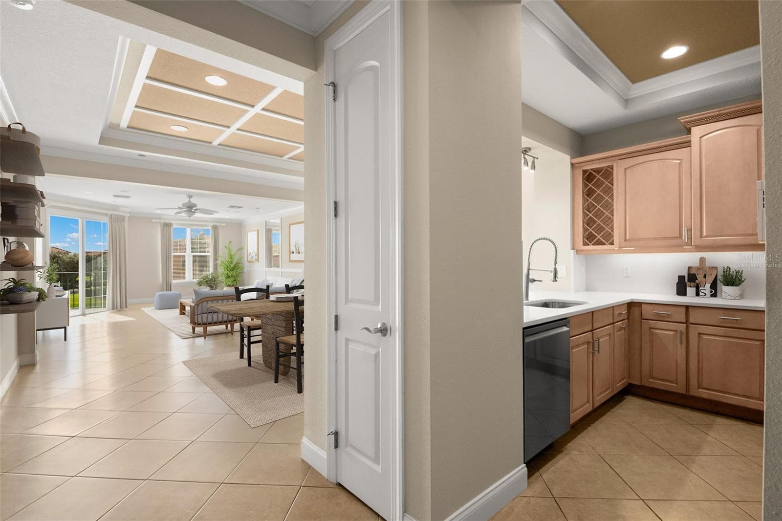 Virtually staged; approaching Kitchen with Dining Room, Living Room and covered Terrace access. - 8 ACADEMY WAY S #123, ST PETERSBURG