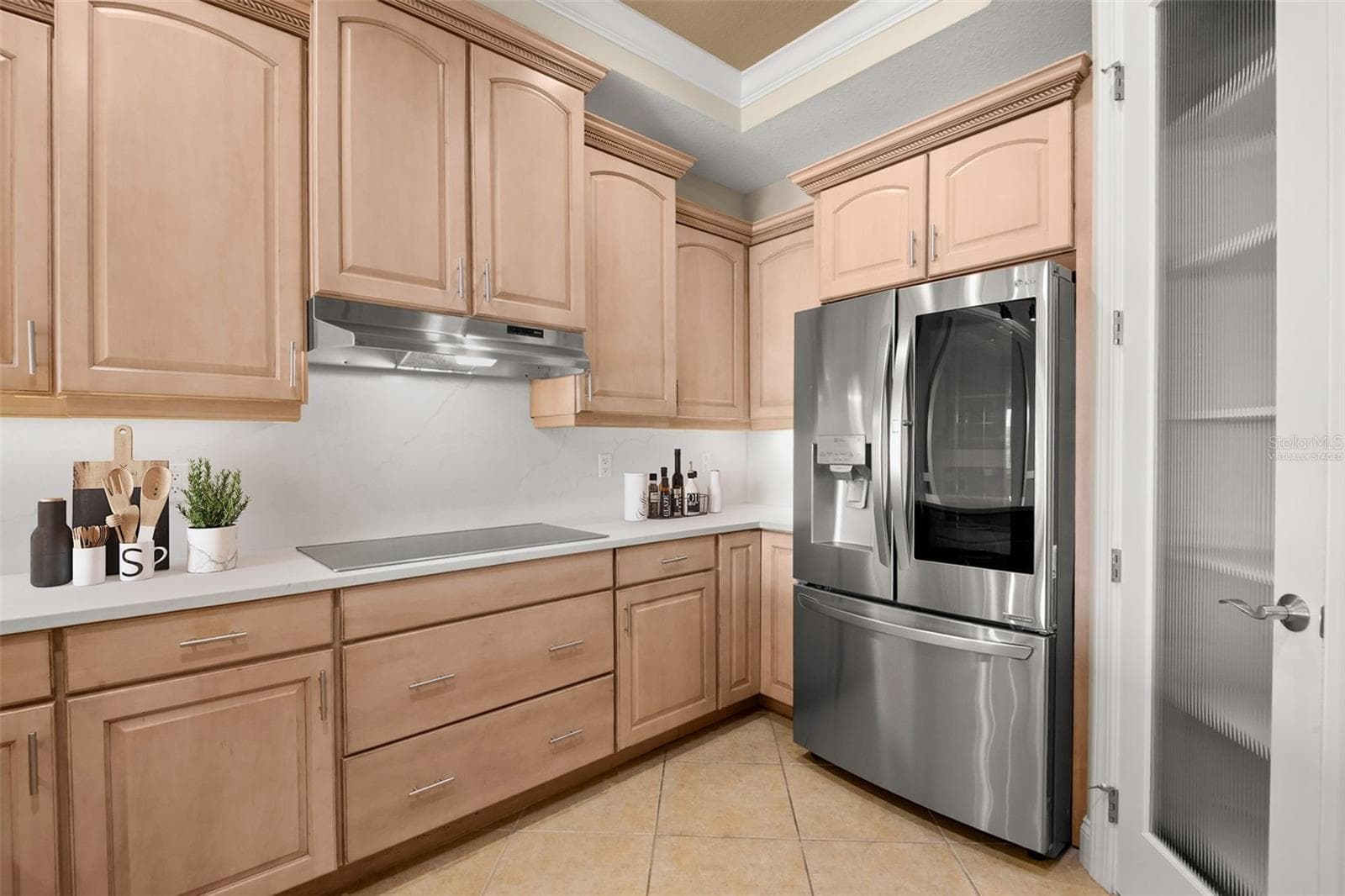 Virtually staged; partial view of the Kitchen featuring extensive counter space. - 8 ACADEMY WAY S #123, ST PETERSBURG