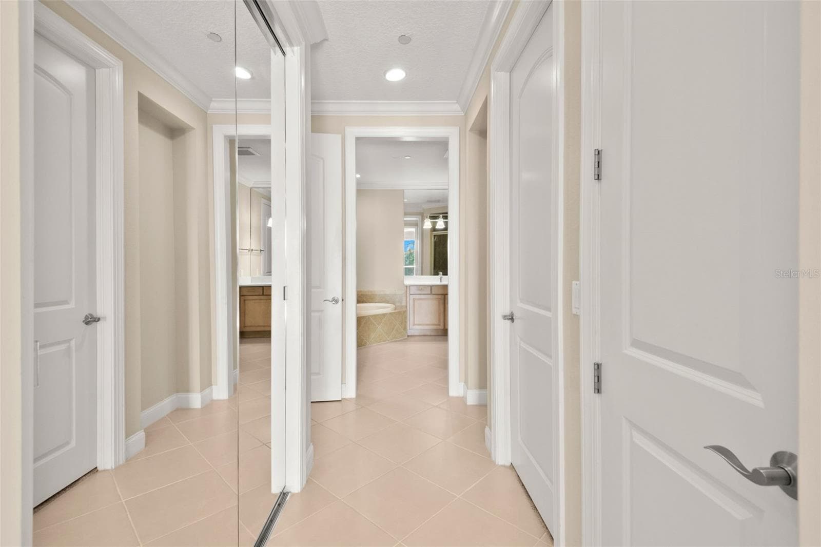 Walking from Main Bedroom to Owner's Bath. - 8 ACADEMY WAY S #123, ST PETERSBURG