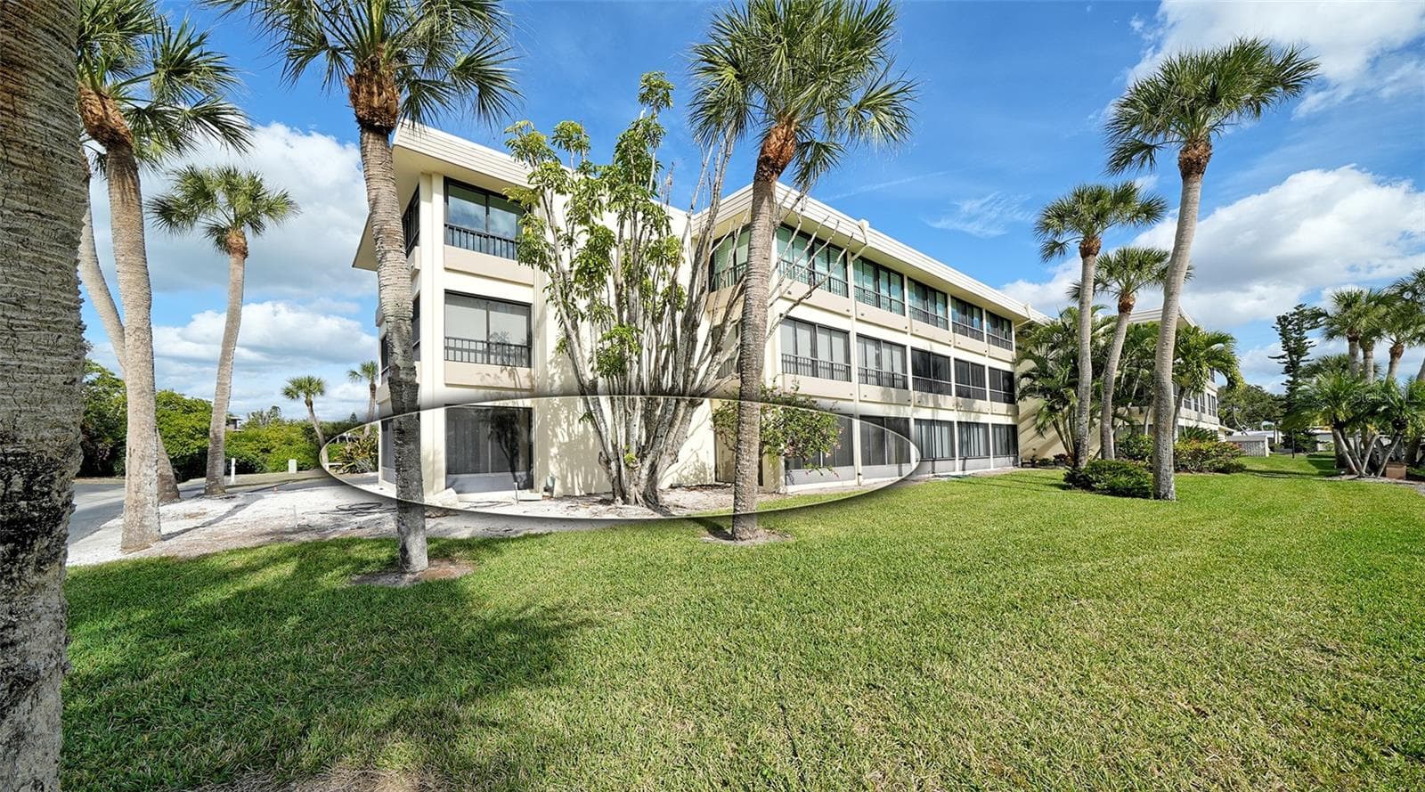 Unit #107 is nestled in the SW corner of the building. - 101 WHISPERING SANDS DR #107, SARASOTA
