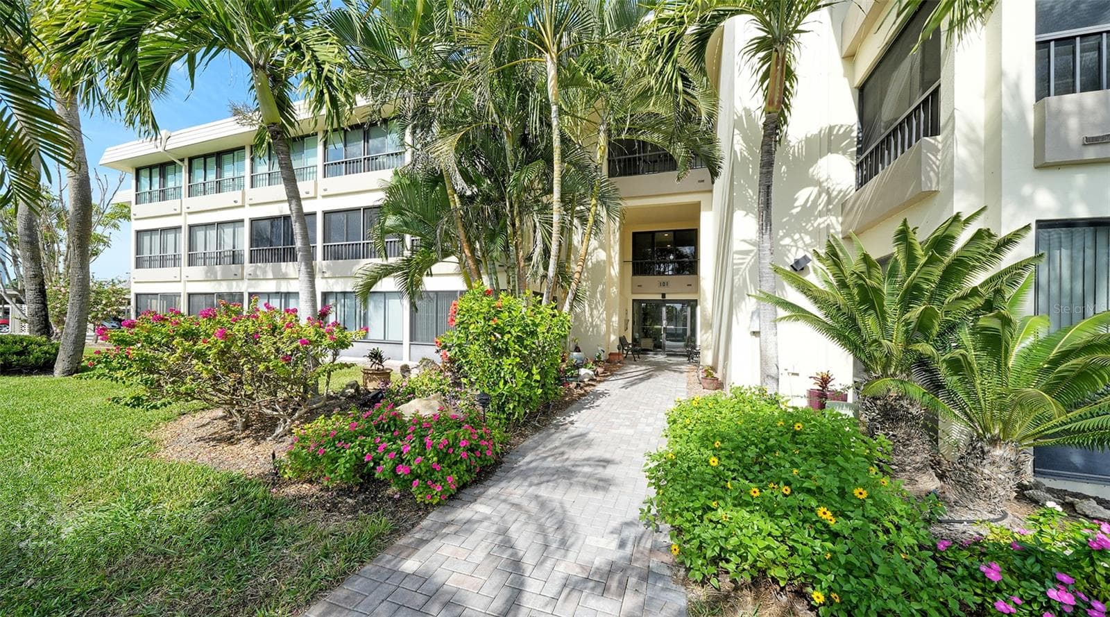 Entrance to the Tropic View building. - 101 WHISPERING SANDS DR #107, SARASOTA