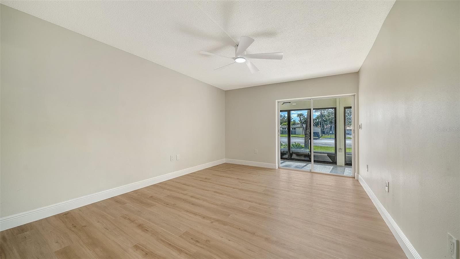 Primary Bedroom with sliders leading to Lanai #2. - 101 WHISPERING SANDS DR #107, SARASOTA