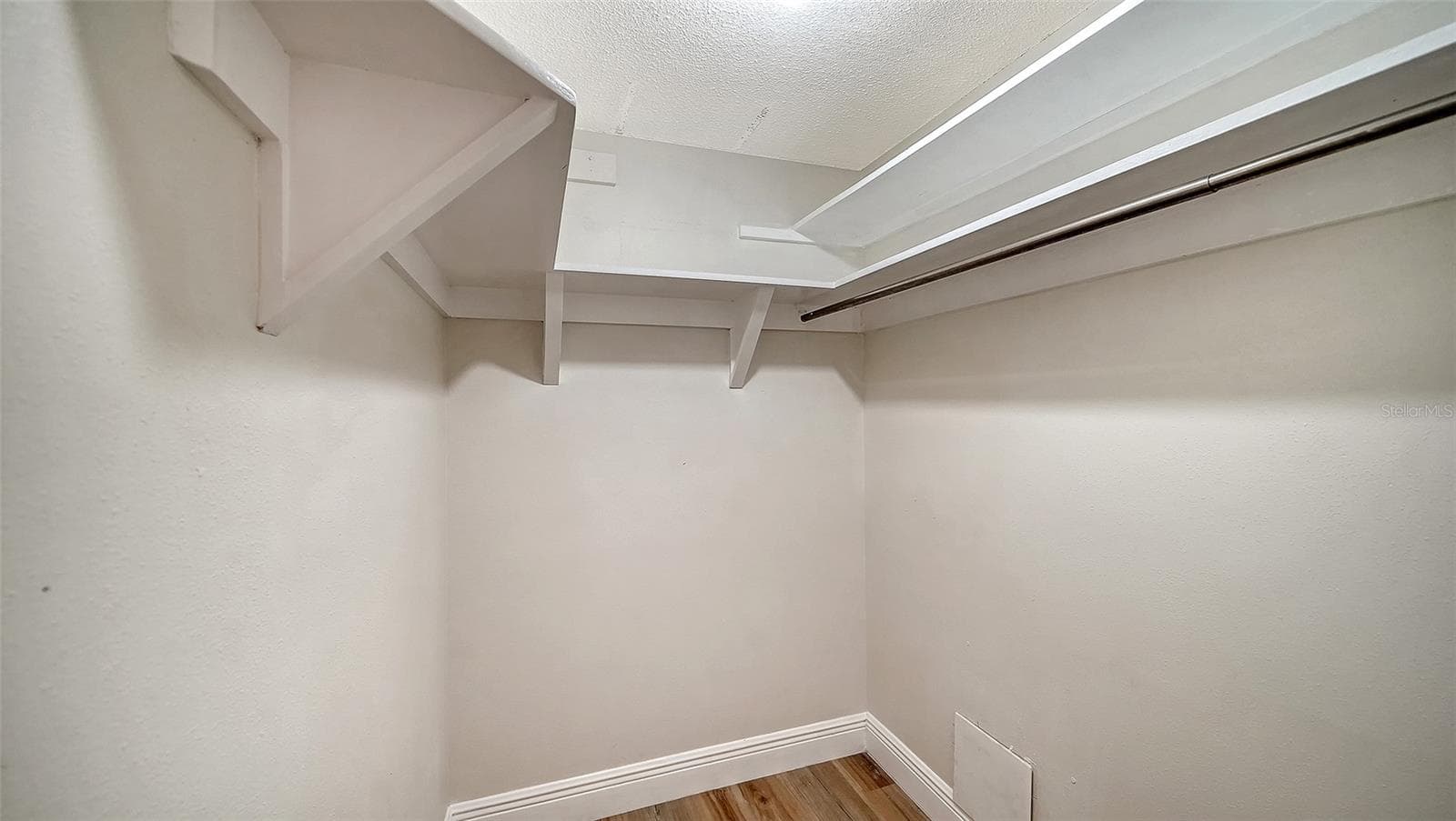 Primary Bedroom walk-in closet. - 101 WHISPERING SANDS DR #107, SARASOTA